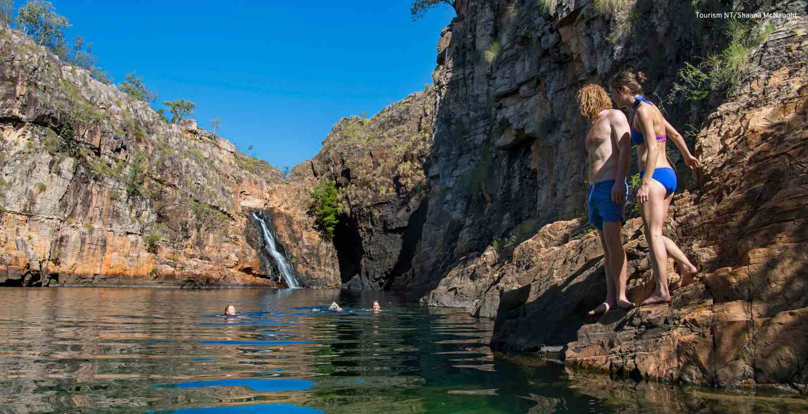 People swimming in billabong