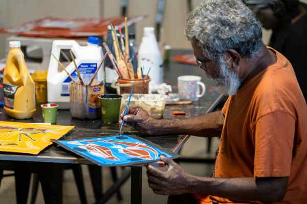 Aboriginal man painting for Marrawuddi Arts and Culture